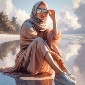 A woman sitting on the beach by the sea